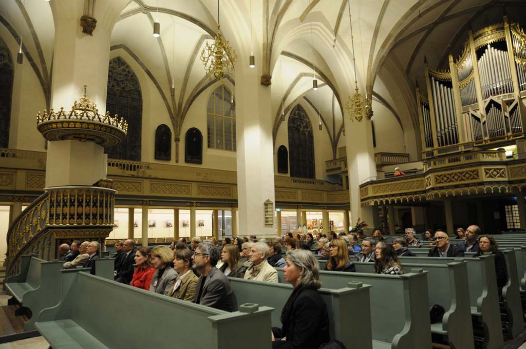 Publikum der ERöffnungsfeier im Vorfeld des Restauarorentags in der Stadtkirche Wittenberg. Foto: Gudrun von Schoenebeck.